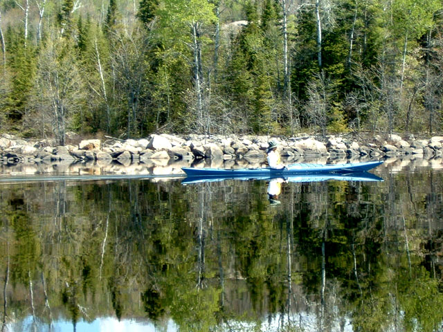 Beautiful shot of kayaking on a calm lake, submitted by C.J. Friesen