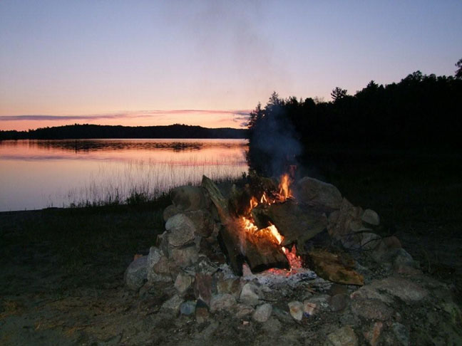 Campfire and beautiful sunset view on Esten Lake.  Photo by Scott Prevost