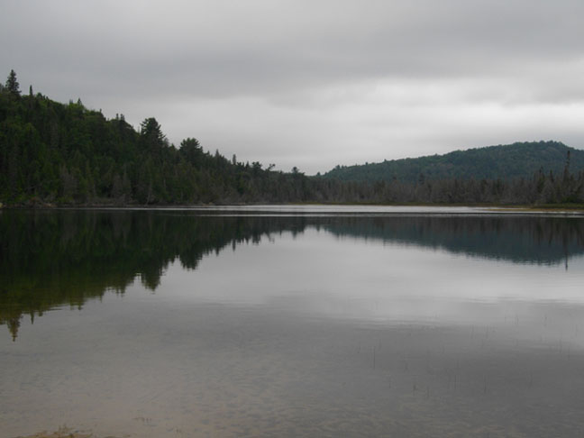 Peaceful reflection on Flack Lake, photo by Janet Coles